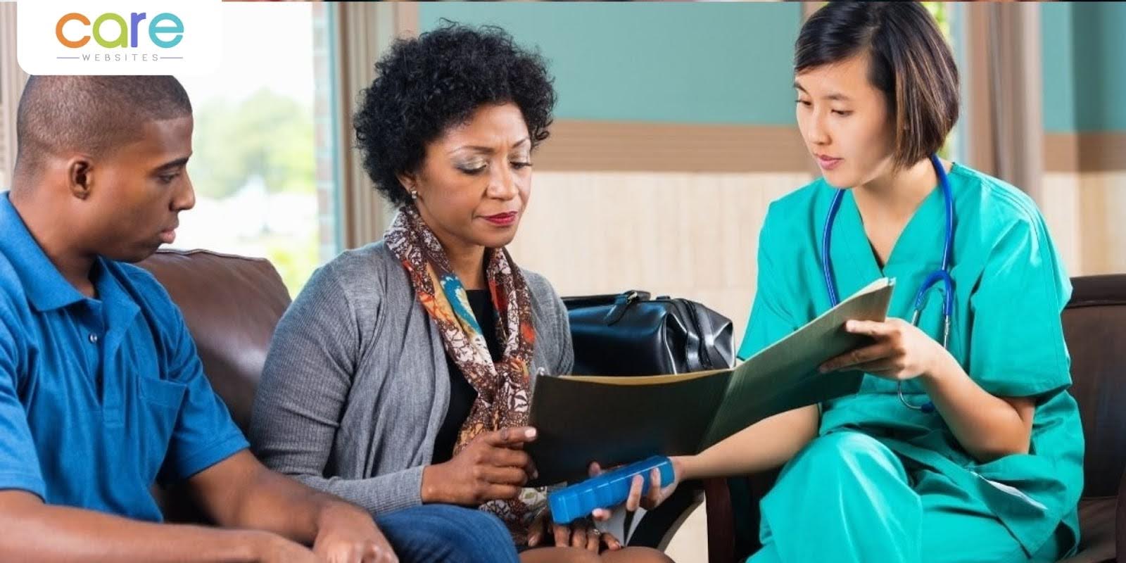 Healthcare professional reviewing documents with patients at a home health agency. Healthcare professional reviewing documents with patients at a home health agency.